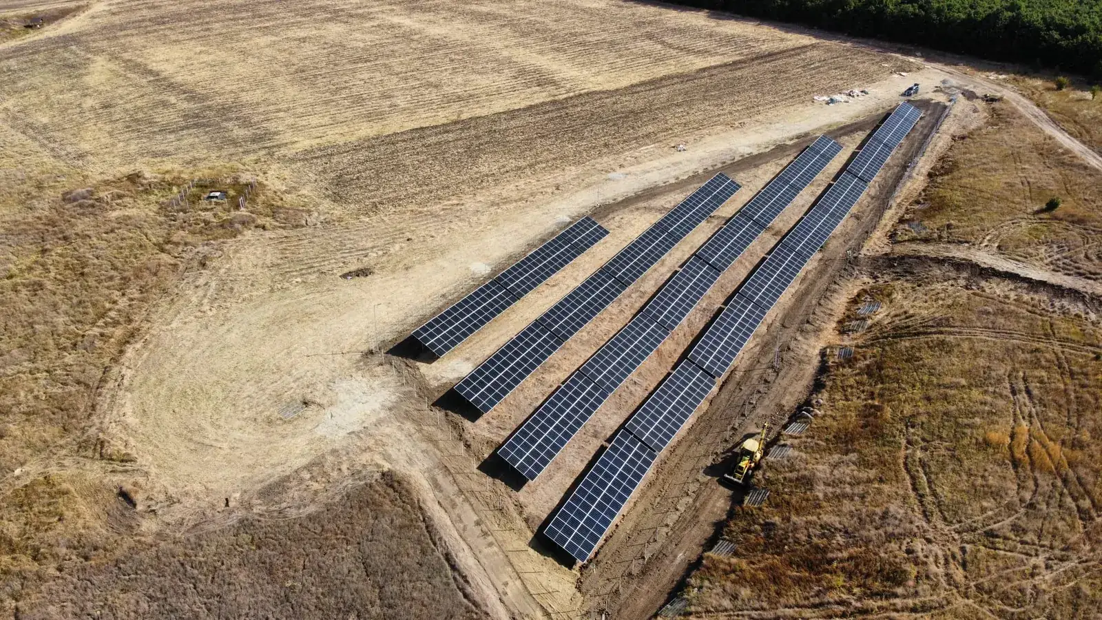 Aerial view of solar panel rows at the solar park in Vâlcea County