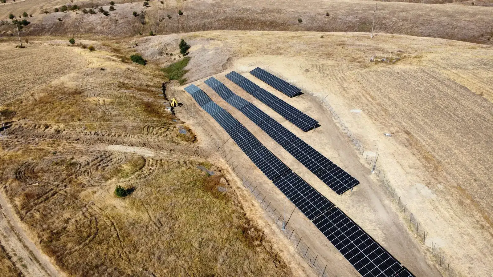 Solar park in the valley with access track