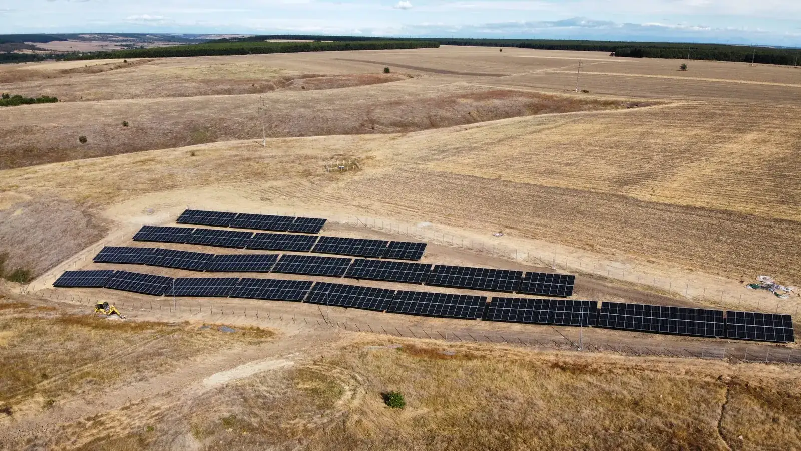Wide aerial view of the solar park and surrounding farmland